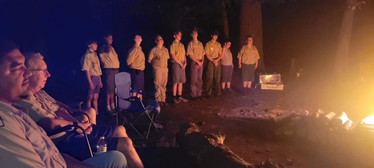Scouts kayaking and fishing at water activity
