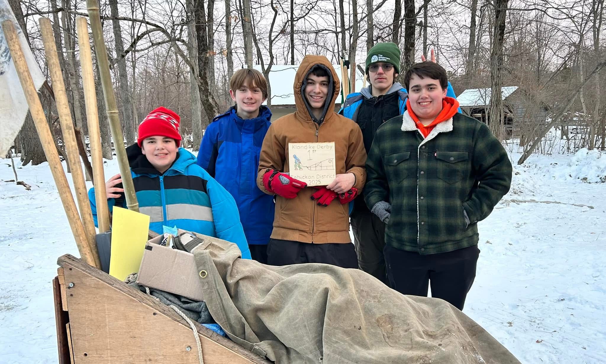 Scouts celebrating after summiting a trail and earning a badge